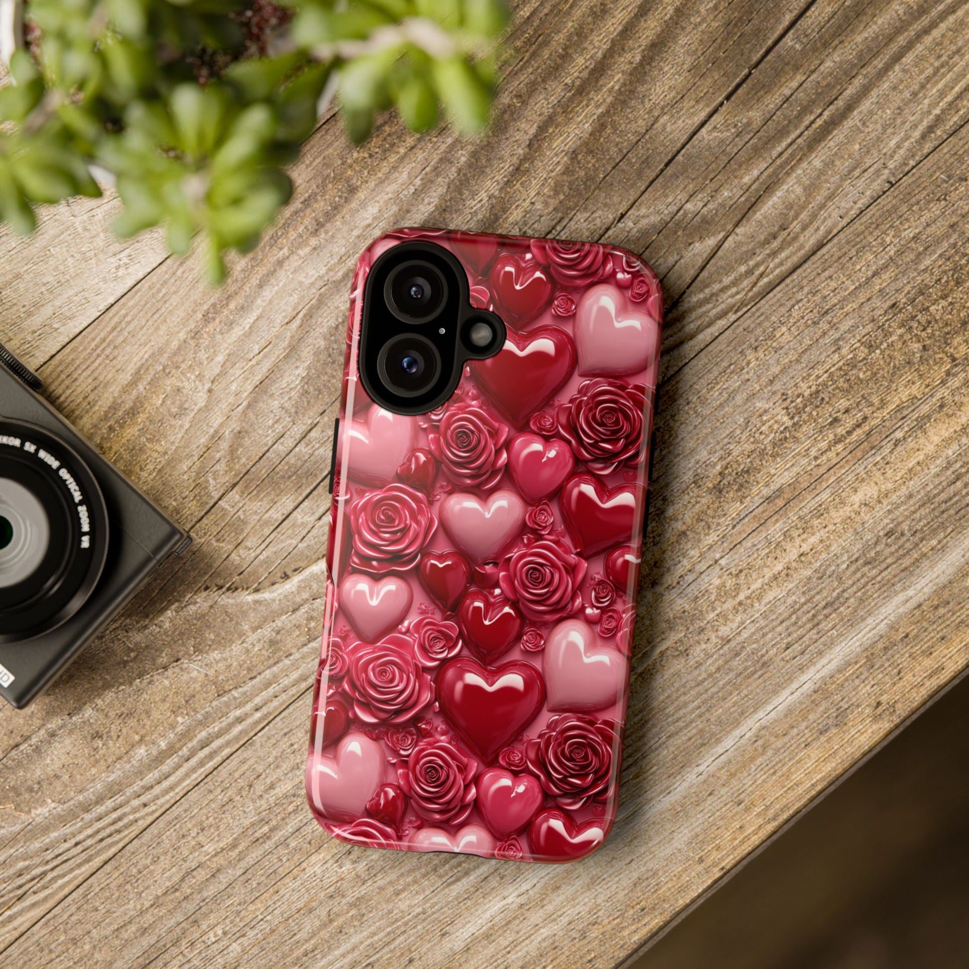 Phone case with floral design on a wooden surface